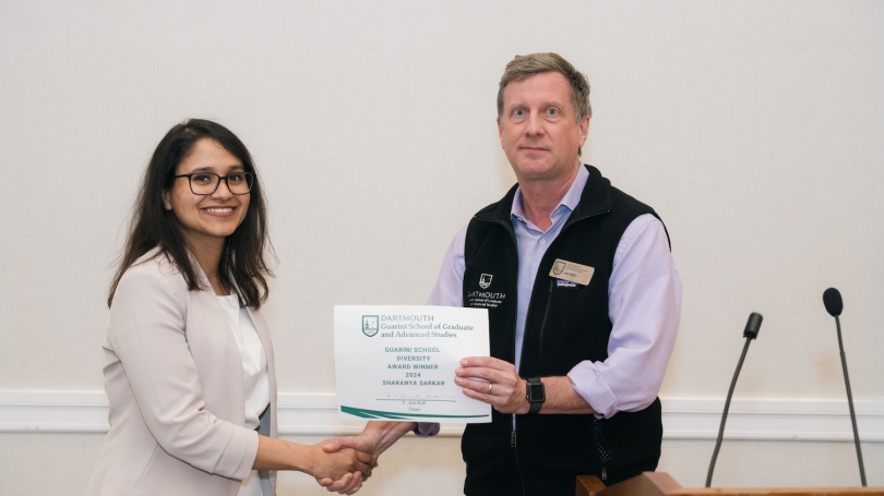 Sharanya Sakar accepts award. 