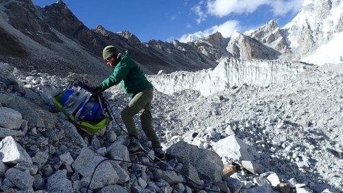 Photo caption: Alexandra Giese taking ground penetrating radar measurements on the Changri Nup glacier in Nepal, 17,500’ above sea leve)