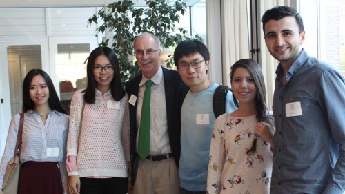 President Phil Hanlon and several incoming graduate students