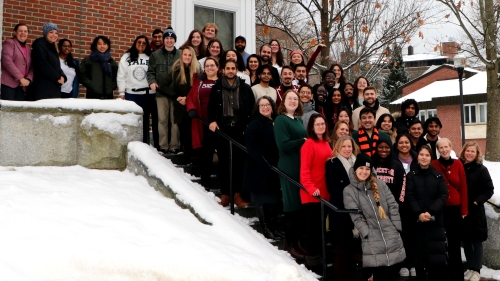 A group photo of ivy plus summit 2024 attendees gathered outside Dartmouth