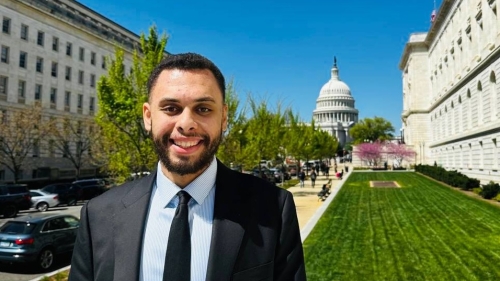 A man in a suit standing outside the Capitol building in Washington, D.C.