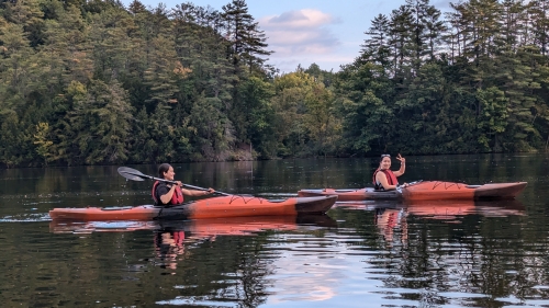 two postdocs enjoying a kayak ride on the river 