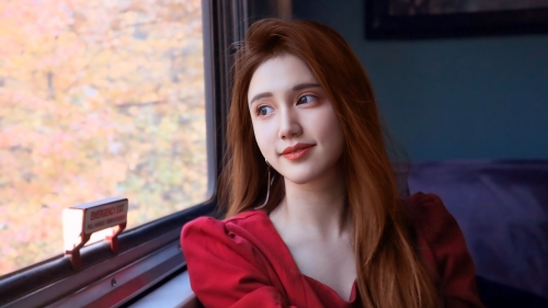 woman staring out a window