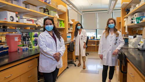 Project Leads for the team winning the top award are, from left, Arti Gaur, assistant professor of neurology at Geisel; Divya Ravi, Guarini '24, and Jordan Isaacs, Guarini '24, both PhD students in the Cancer Biology Program.