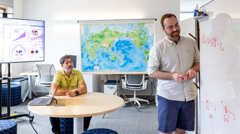 two men in an academic classroom.