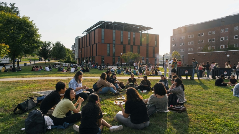 Guarini community enjoying a barbecue outside Anonymous Hall