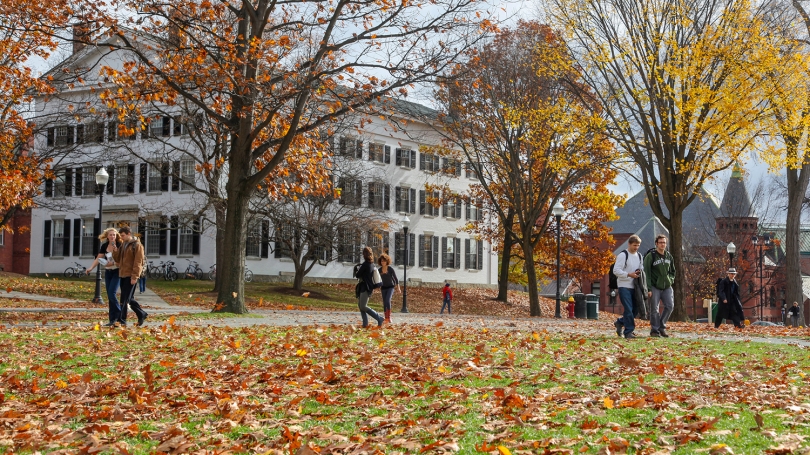 Students walk through campus in the fall.