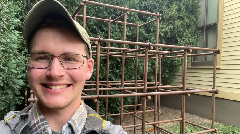 Luke Fannin standing in front of monkey bars.