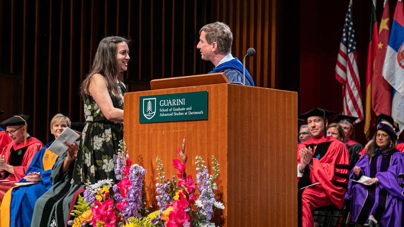 Sally Demirdjian receives the Community award from Dean Jon Kull on stage