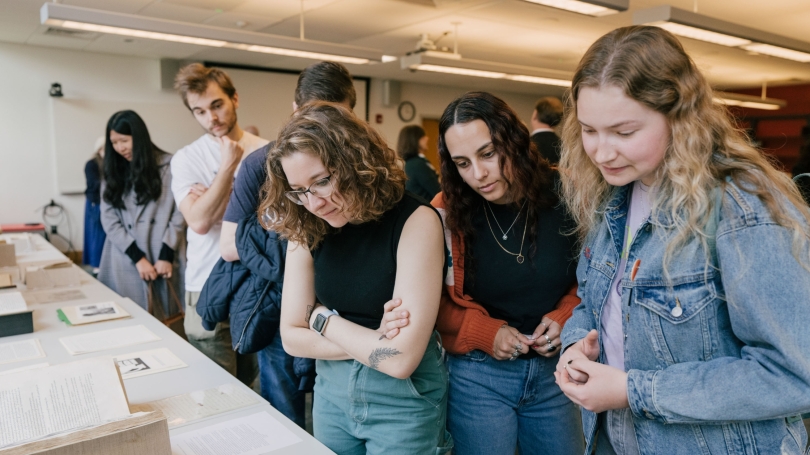 Students looking at a library display